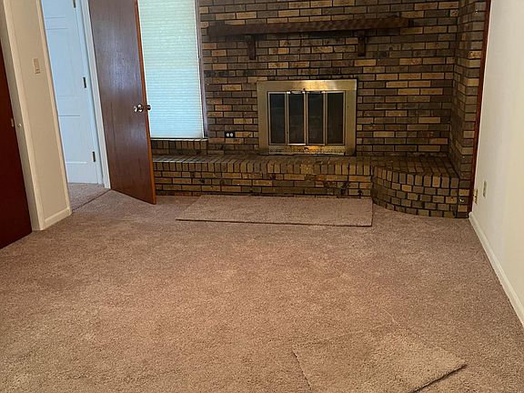 Den with new carpet.