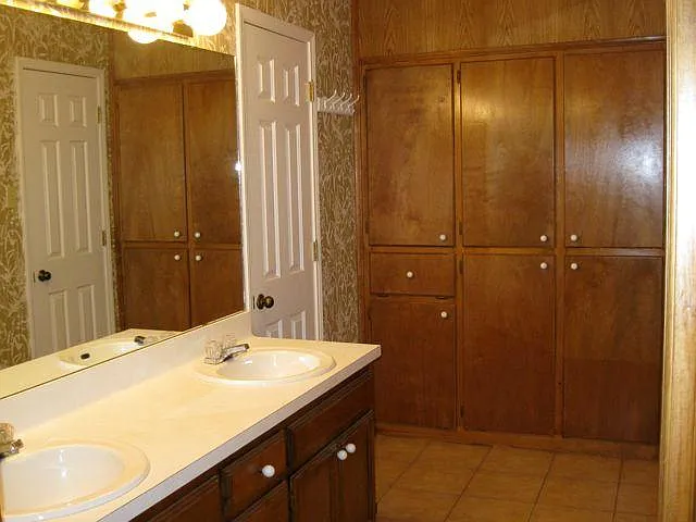 Master vanity area, door to tub/shower/toilet area