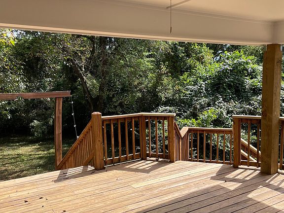 Large covered deck in back. Watch TV, grill, and enjoy the outdoors.
