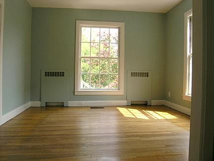 Dining Room. Two large windows, hardwood floors, large entry into living room.