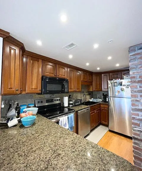Expansive counterspace with new appliances. Lined cabinets with abundance of shelf space.