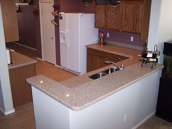 Another kitchen angle. Note undermount sink and wine bar.
