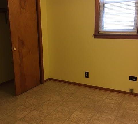 Bedroom with wall-to-wall closet.