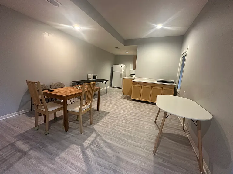 Kitchen equipped with full size fridge, microwave, and new induction range.