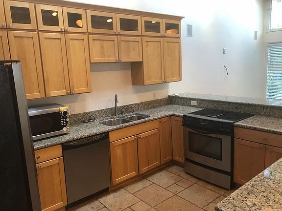 Kitchen with new appliances and granite countertops