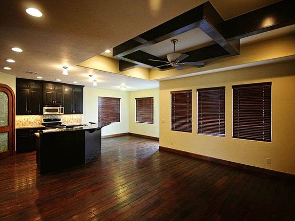 Living room with beautiful ceiling and dining room
