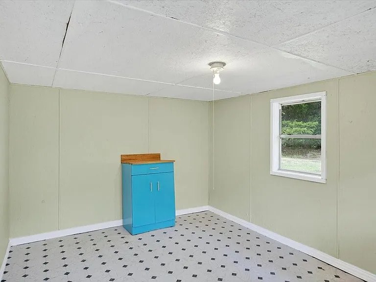 Cute finish out in the she-shed, storage space. Has electricity.