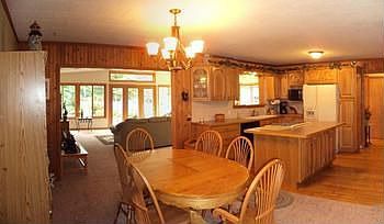 The kitchen includes a gas ovenrange, refrigerator, dishwasher and disposal. Updated kitchen cabinet