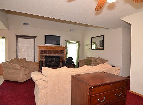 Living room with brick fireplace