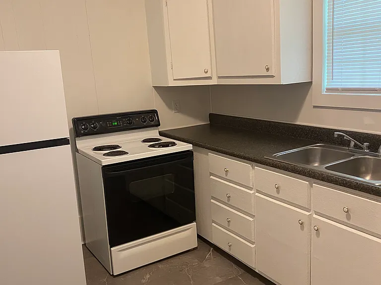 Plenty of cabinet space with a new refrigerator and stove included.