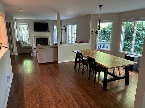 main living area with fireplace and dining room