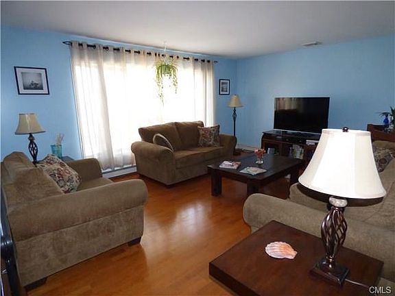LIVING ROOM WITH BAY WINDOWS