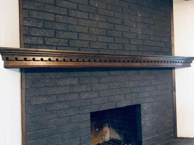 Gorgeous fireplace! Ready with gas line to start the fire, gas logs, or wood to burn.