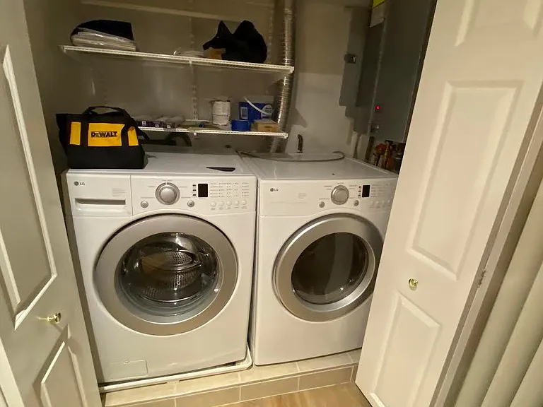 utility closet and laundry. Includes tankless water heater.