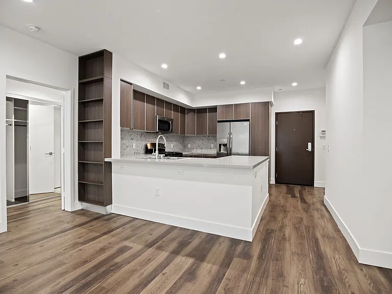 Kitchen and Dining Area with Recessed Lighting and Vinyl Flooring