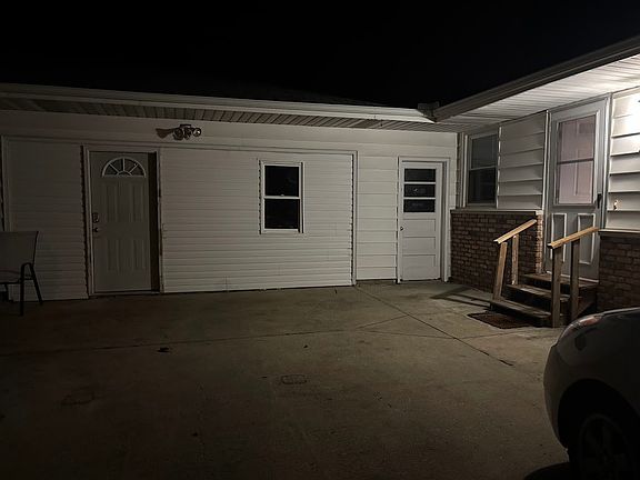 Door to the right is the rental. Renovated garage not included in rental