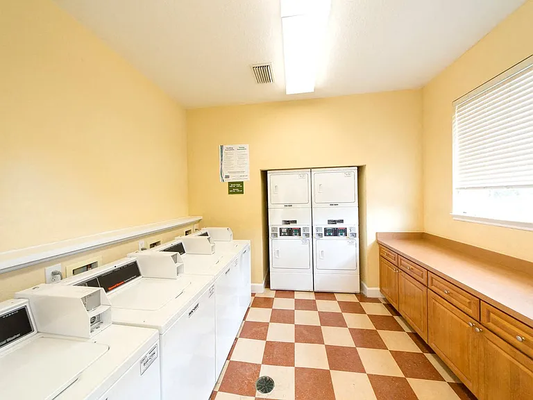 Laundry room with washers and dryers at Gregory Cove in Jacksonville, FL