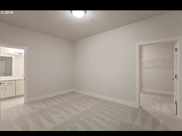 Bedroom with walk in closet and attached bathroom in lower level (in laws suite)