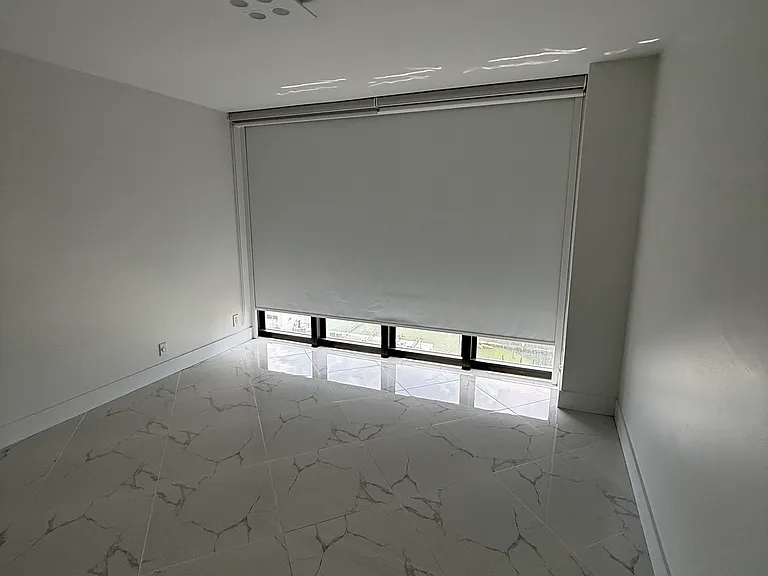 GUEST BEDROOM or OFFICE with dimmable designer lighting, full wall mirror, floor-to-ceiling impact windows, electric blackout curtain, zebra shades & large closet system