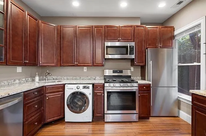kitchen with washer (dryer on other side) - 57 W 7th St #2