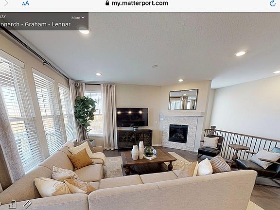 Great room with gas fireplace. (Photo of model home)