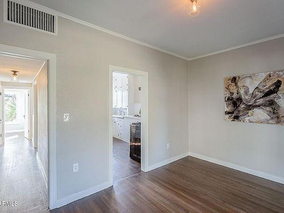 Dining room leading to kitchen and hallway
