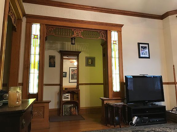 Front room with lighted entry hall and stained glass.
