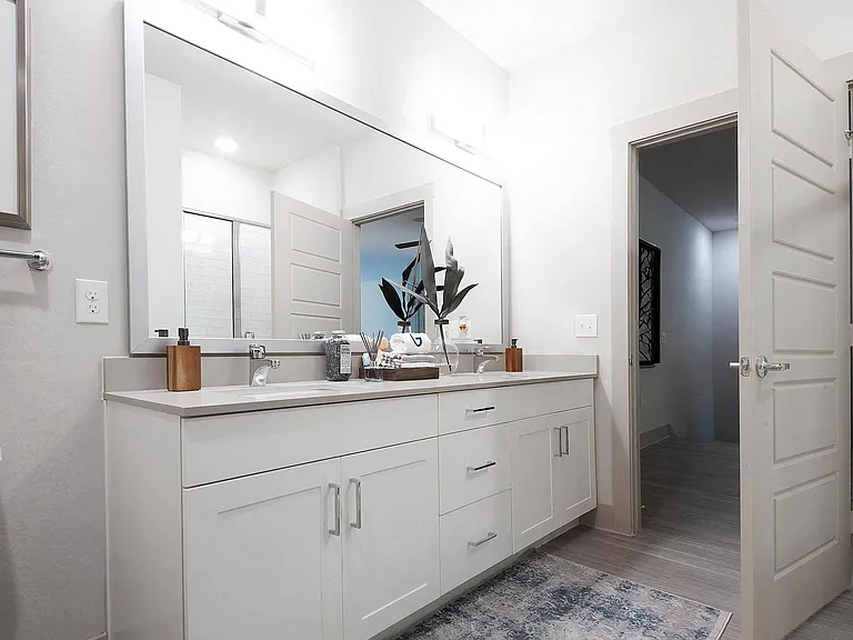 Modern Bathroom Featuring Double Vanity and Glass-Enclosed Shower