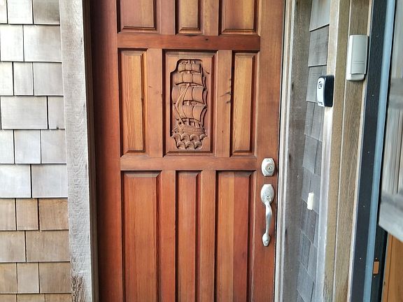 Front door, garage on right