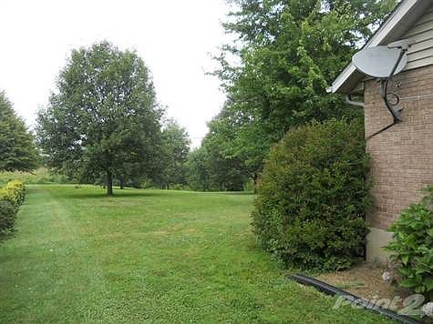 The 1 acre lot has plenty of level yard to work with.