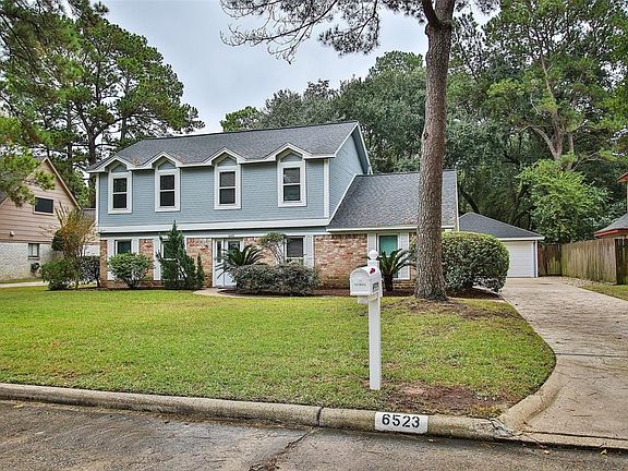 The front exterior was recently painted a beautiful neutral grey. The mature trees in the front yard provide shade and add great curb appeal! PLUS - a brand new roof is being installed next week! Additional mechanical updates include a 50 gallon wate