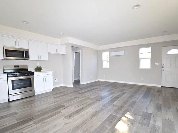 View from Sliding Door to Half Bathroom and Stairwell Leading to the Master Suite.