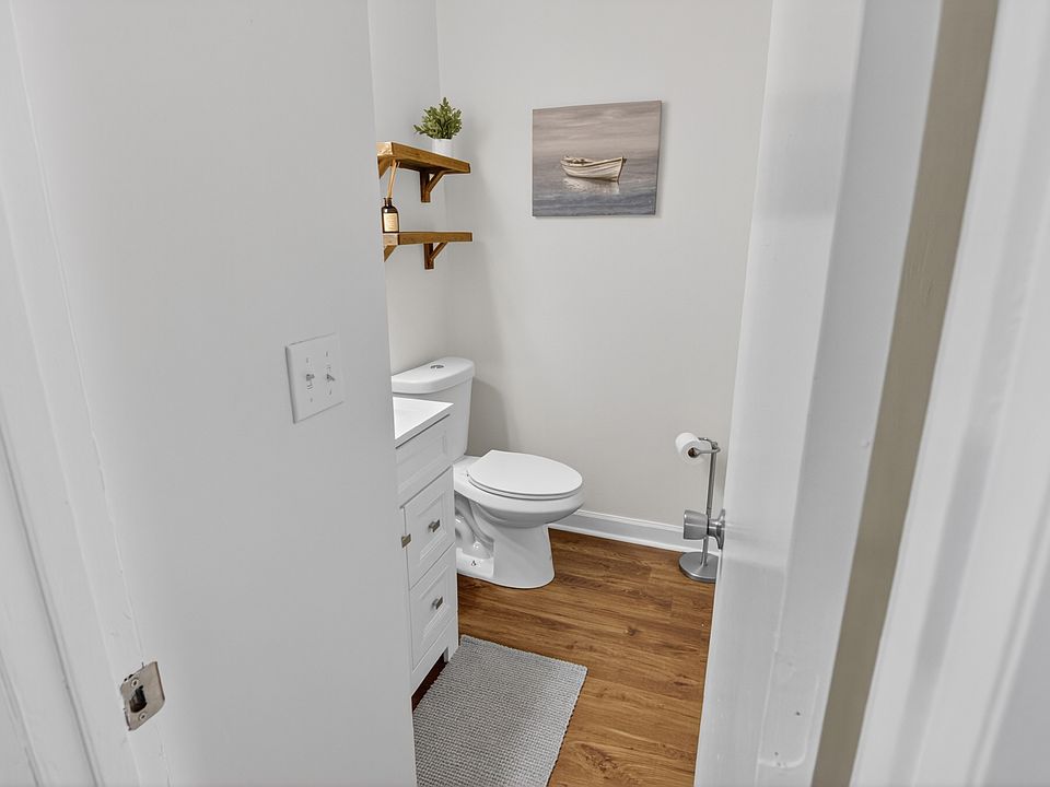 Fully renovated half bath between the living room and kitchen