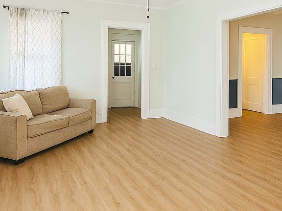 Living Room - AI modified to remove current tenant's belongings.