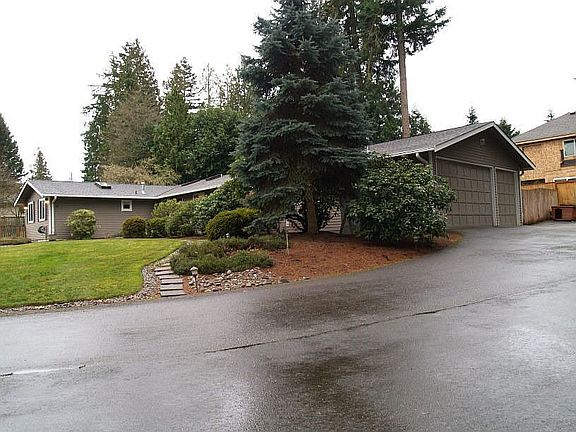Attached 3 car garage with extra parking for guests or RV 