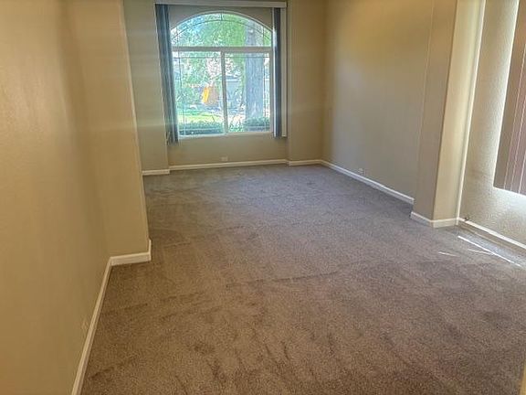 Dining Room/Living Room with large window for the morning sun looking on to a mature Silver Oak tree.