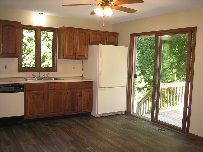 Kitchen with walk out to deck and backyard