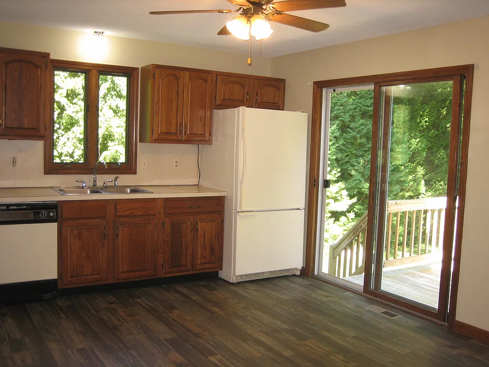Kitchen with walk out to deck and backyard