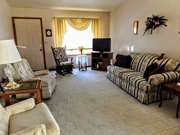 Living room has vaulted ceiling