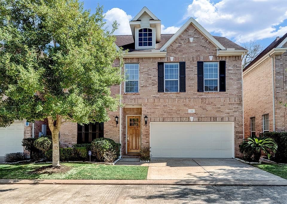 Stately brick facade and the rare 2 car driveway welcome you home.