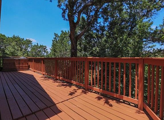 HUGE WRAP AROUND DECK IN THE FRONT AND ON THE SIDE OF THE HOUSE.