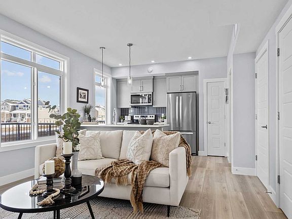 A photo of the great room of the Coltrane townhome model by Brookfield Residential