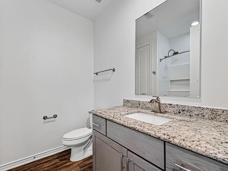 Private ensuite bathroom with modern finishes.