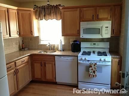 Renovated Kitchen
						:
						New cabinets, granite counters, and gleaming hardwood opens up to dining area