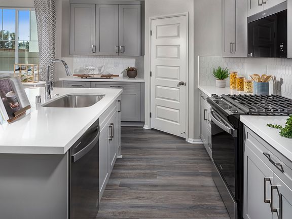 Kitchen in the 3017 floorplan at a Meritage Homes community in Temecula, CA.