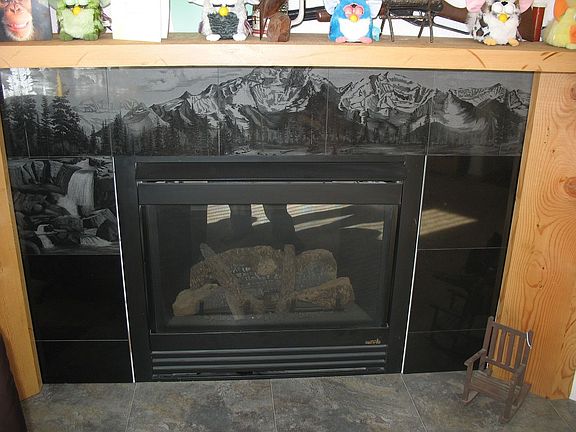 custom, etched marble fireplace.