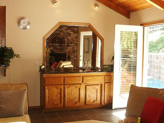 Bar with sink next to patio door