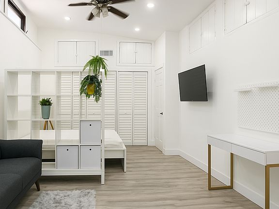 Extra-high ceilings with ceiling fan and personal AC unit for added comfort!