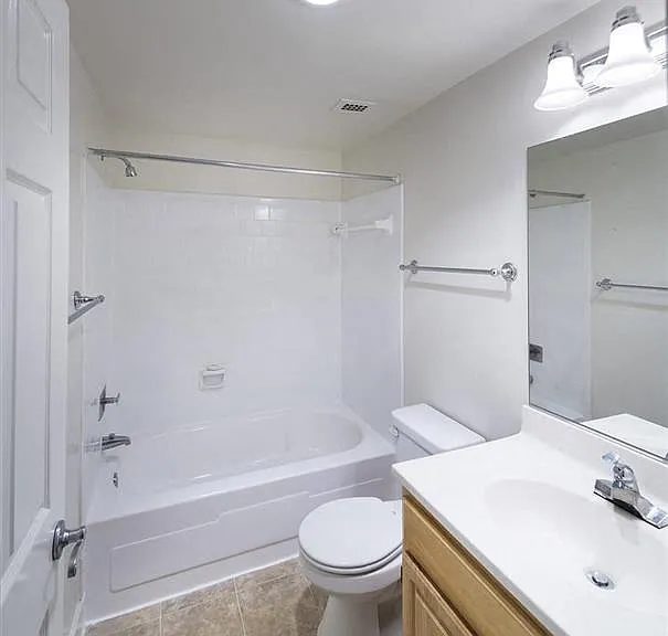 GOLD bright bathroom with a tub