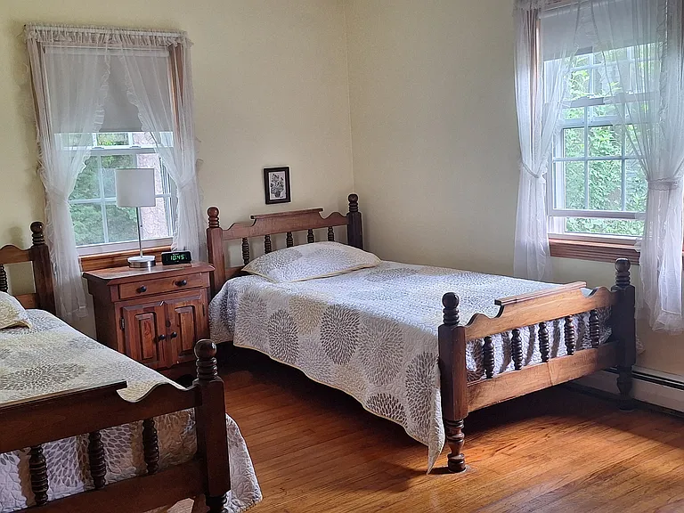 Second front bedroom with twin beds and a shared shower with master bedroom.